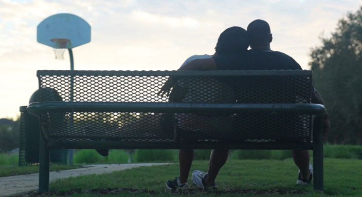 Eric and Sholanda sitting outside