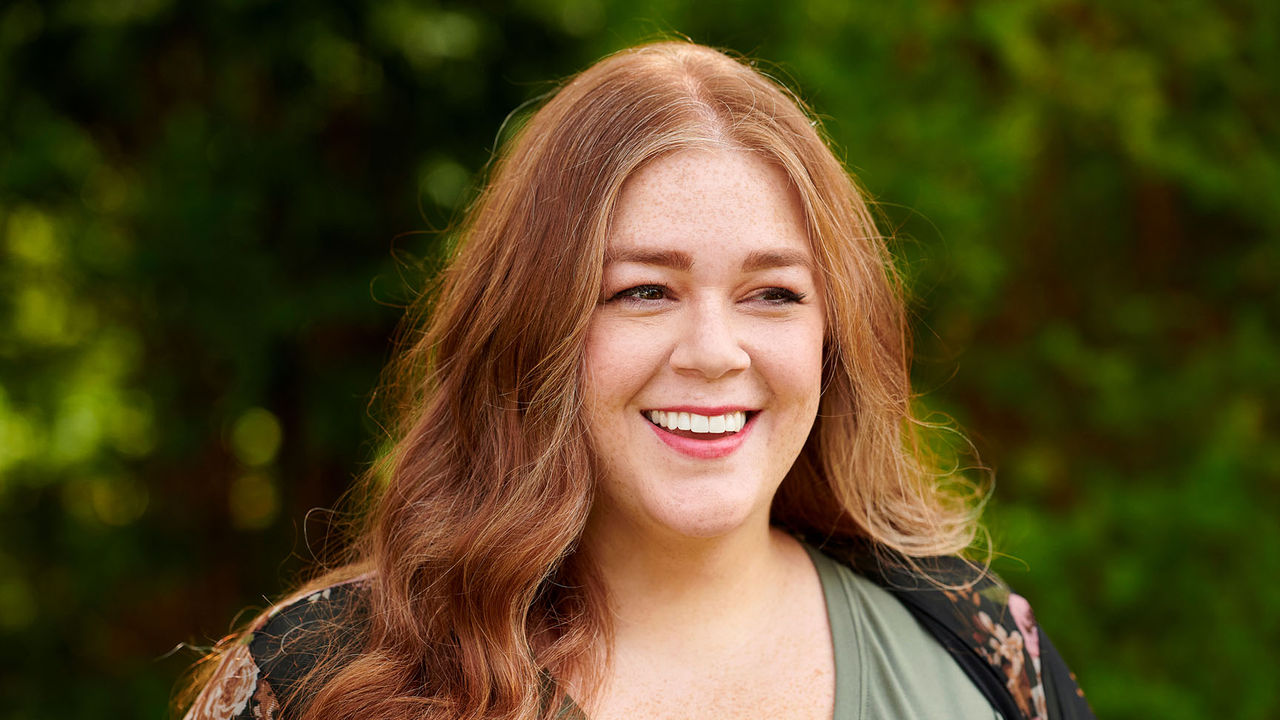 Alicia smiling and looking at the view