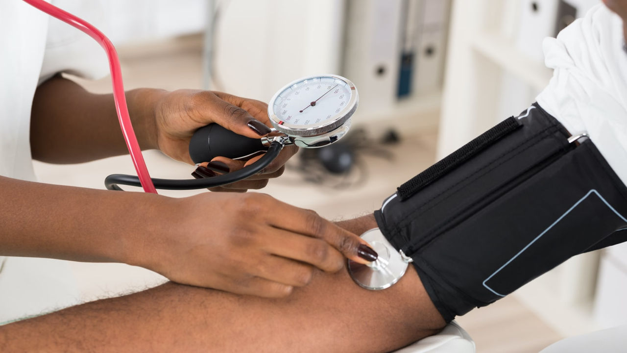 A patient getting their blood pressure taken