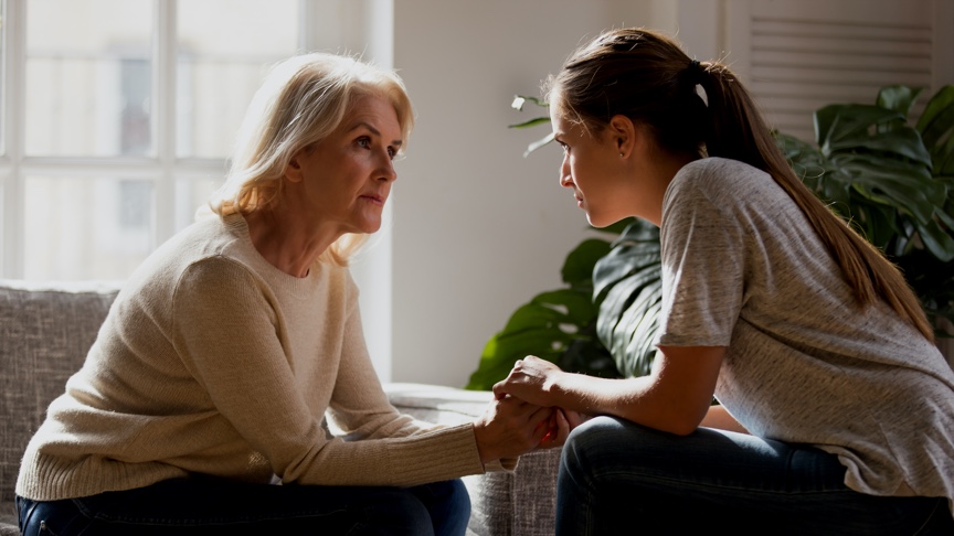 Two women comforting each other