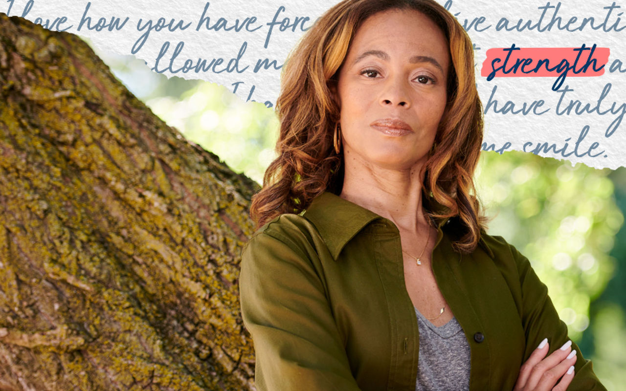 Courtney with her arms crossed confidently