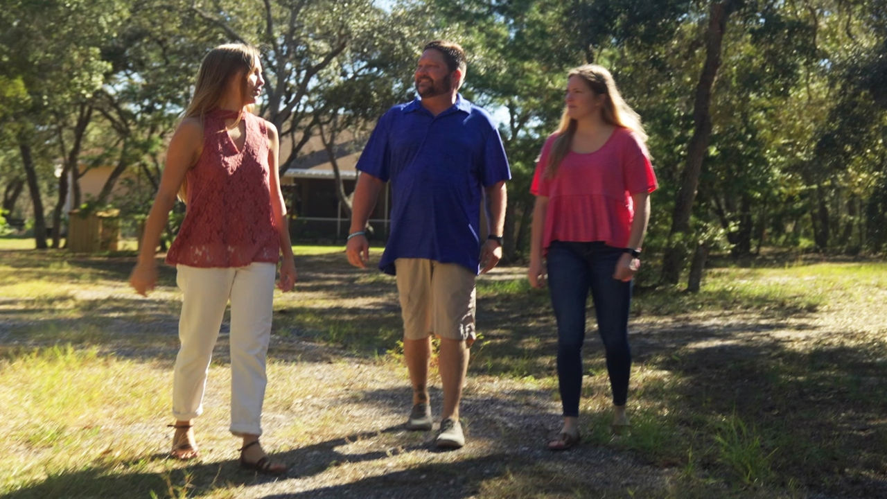 A group of people walking outside