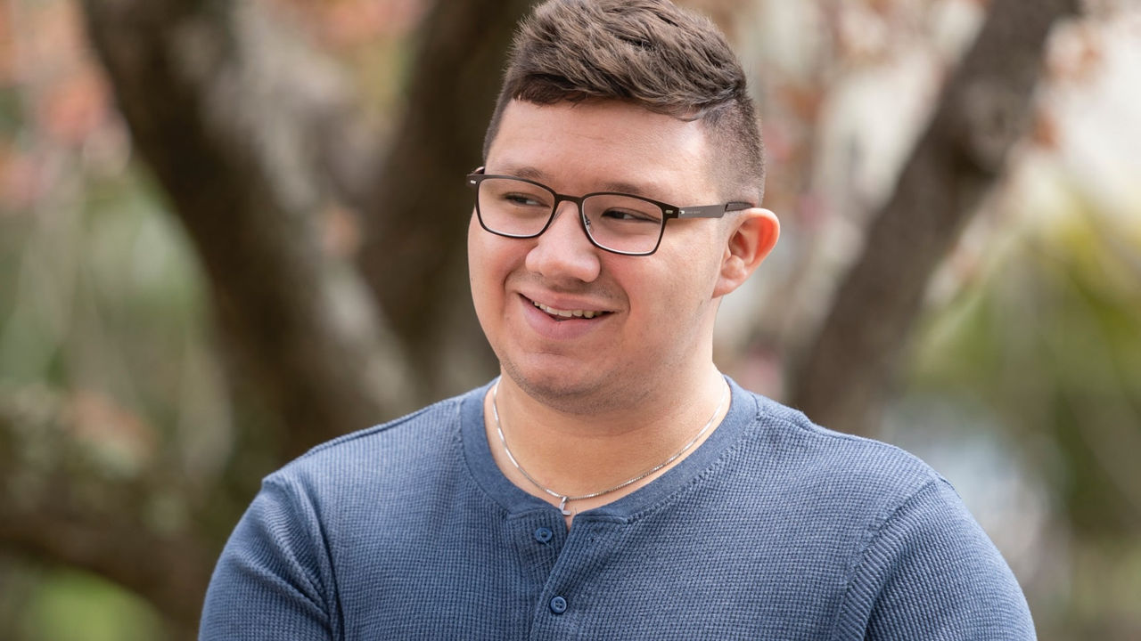 Victor M. smiling outside